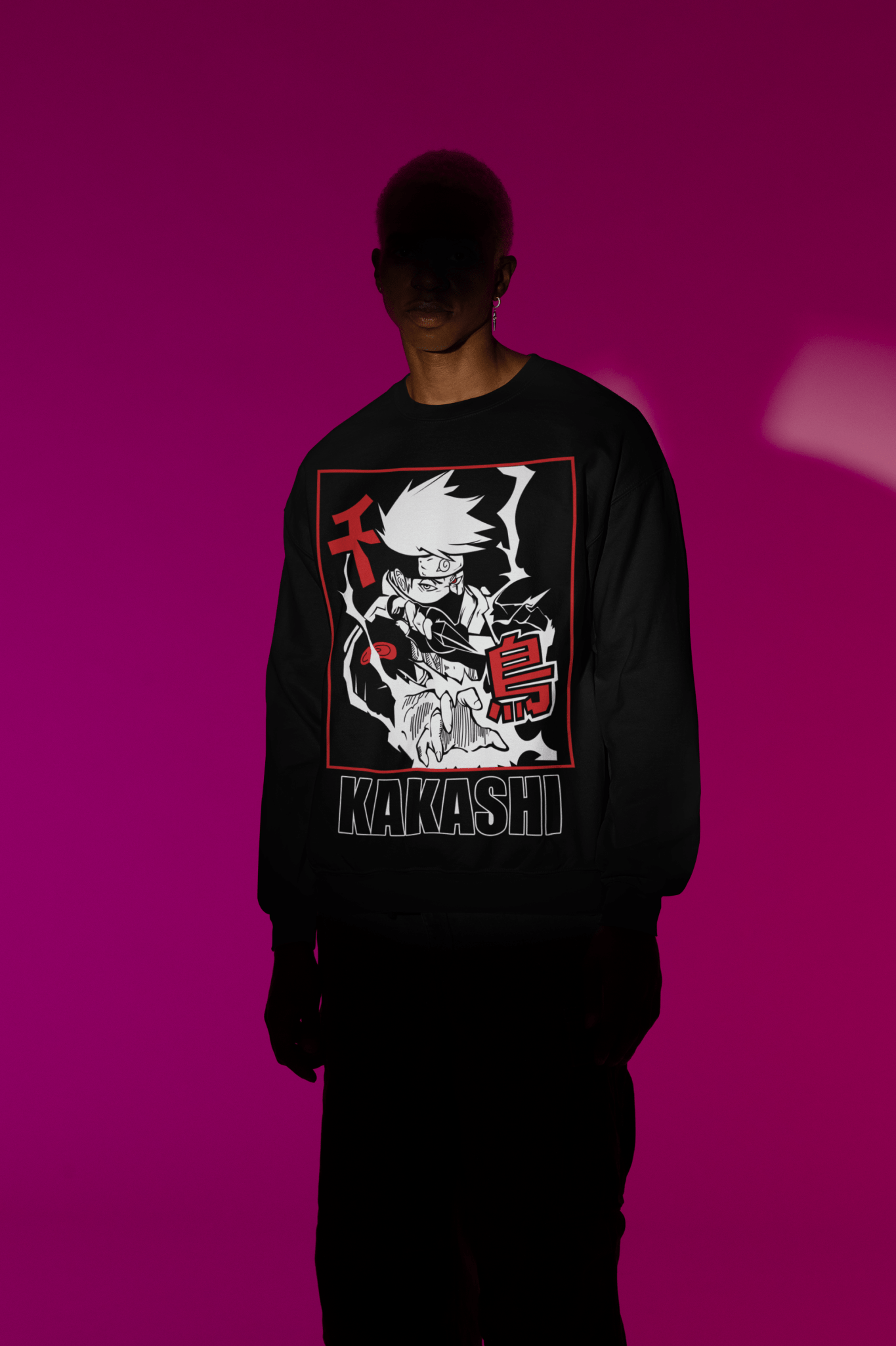 Man in spotlight wearing black Kakashi anime crewneck sweatshirt, magenta background