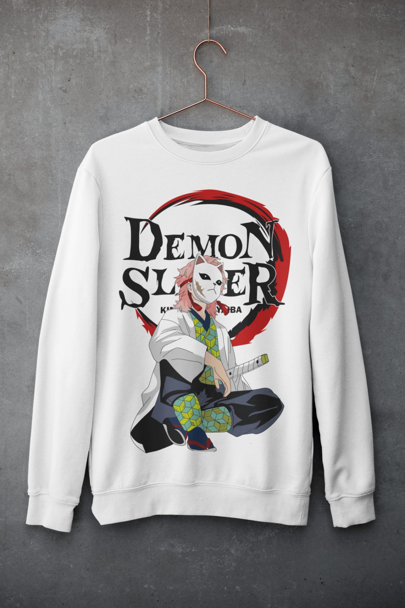 White crewneck sweatshirt with Demon Slayer anime character design, hanging on concrete wall